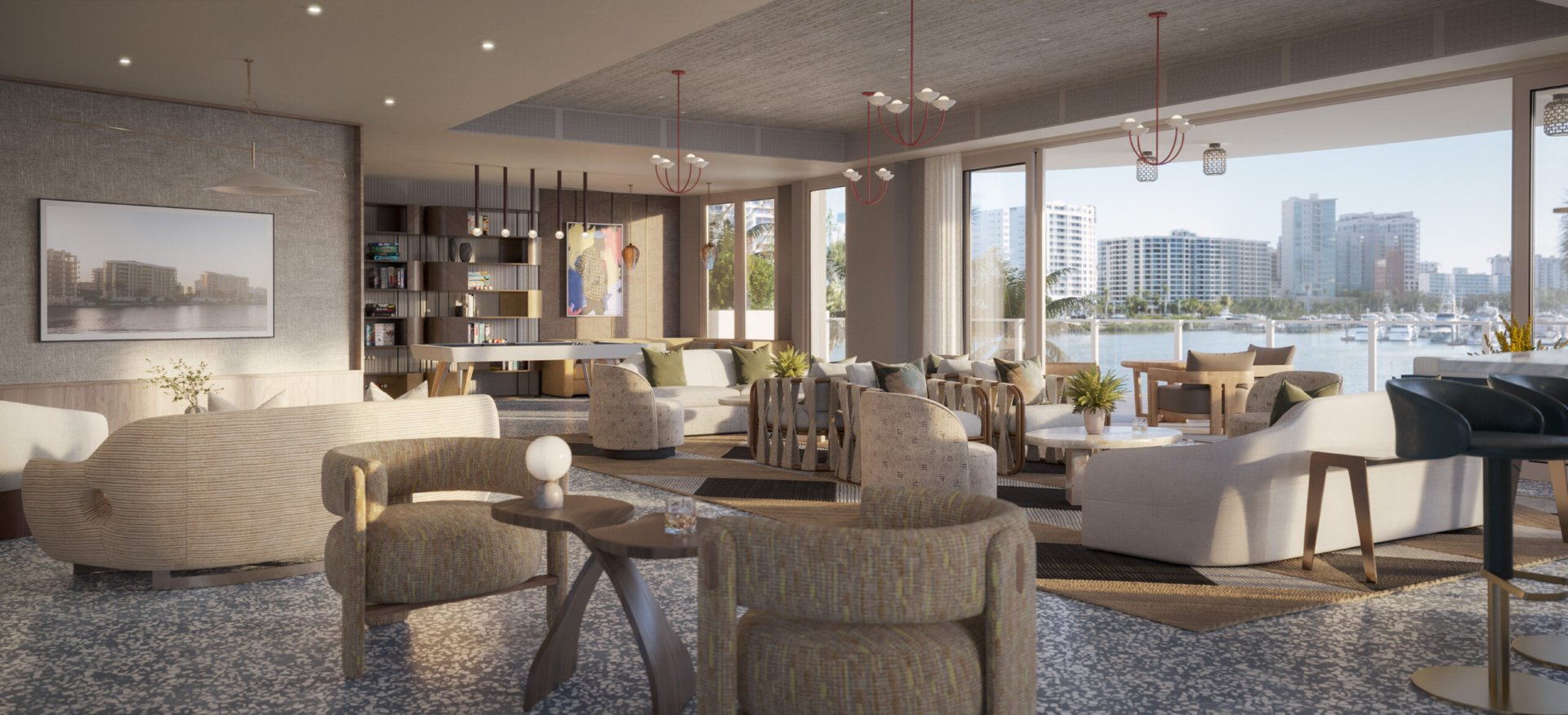 Resident lounge at Amara on Sarasota Bay with comfortable seating areas, contemporary design, and large windows overlooking the waterfront and downtown Sarasota.