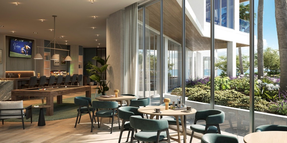 Owners’ lounge with refined social spaces, modern furnishings, and floor-to-ceiling windows overlooking landscaped outdoor areas.