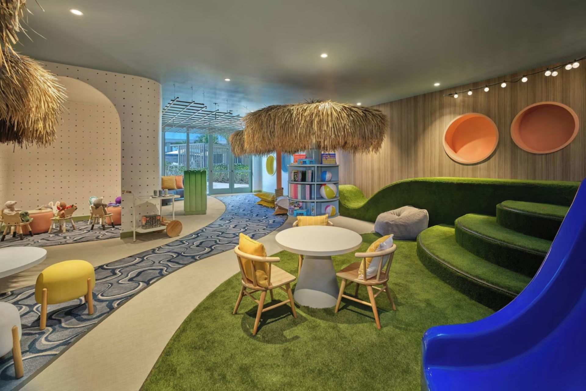 Colorful children’s club with play areas and seating at St. Regis Residences Longboat Key