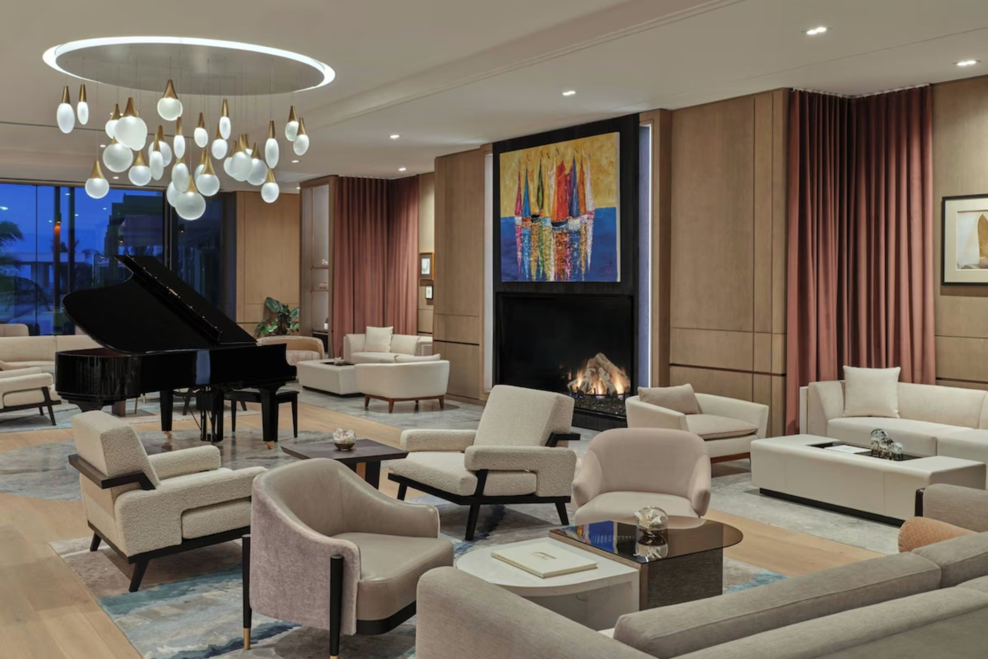 Private residents’ lounge at St. Regis Longboat Key with luxury seating, fireplace, and refined social spaces.