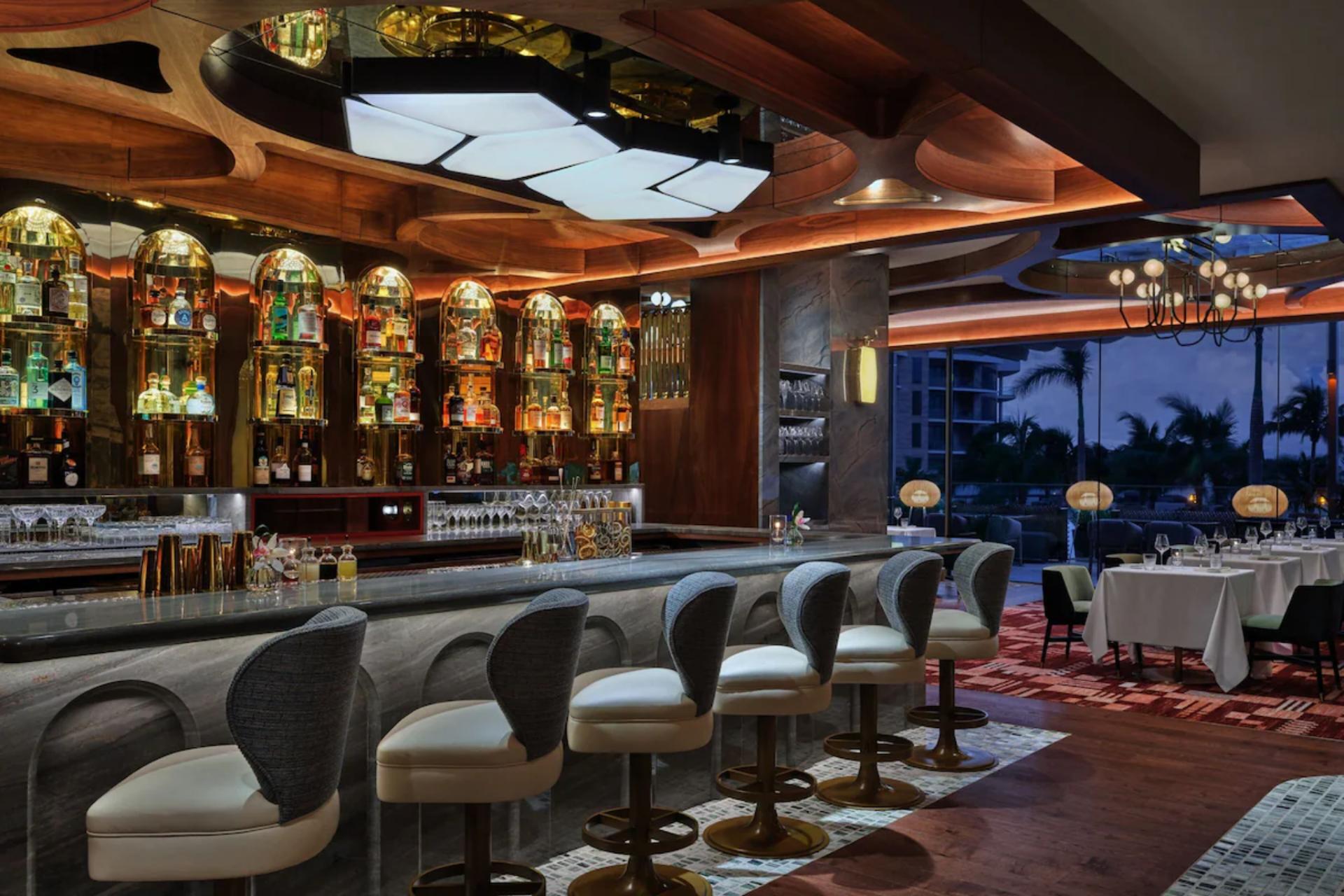Elegant bar and lounge at St. Regis Longboat Key offering refined interiors, crafted cocktails, and a sophisticated social atmosphere.