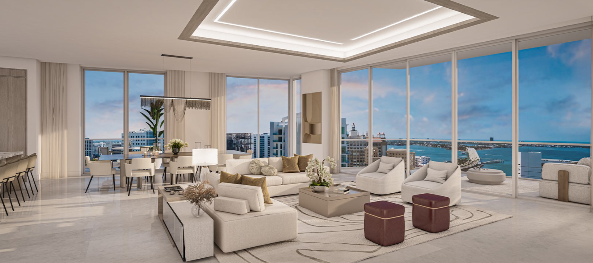 Luxury open-concept living room at The Ritz-Carlton Residences Sarasota Bay featuring floor-to-ceiling glass, expansive terrace access, and panoramic waterfront views.