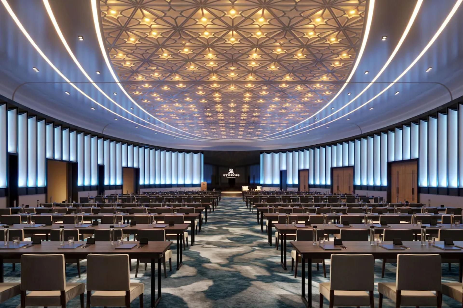 Elegant event space at St. Regis Longboat Key with modern seating, architectural lighting, and a spacious layout.