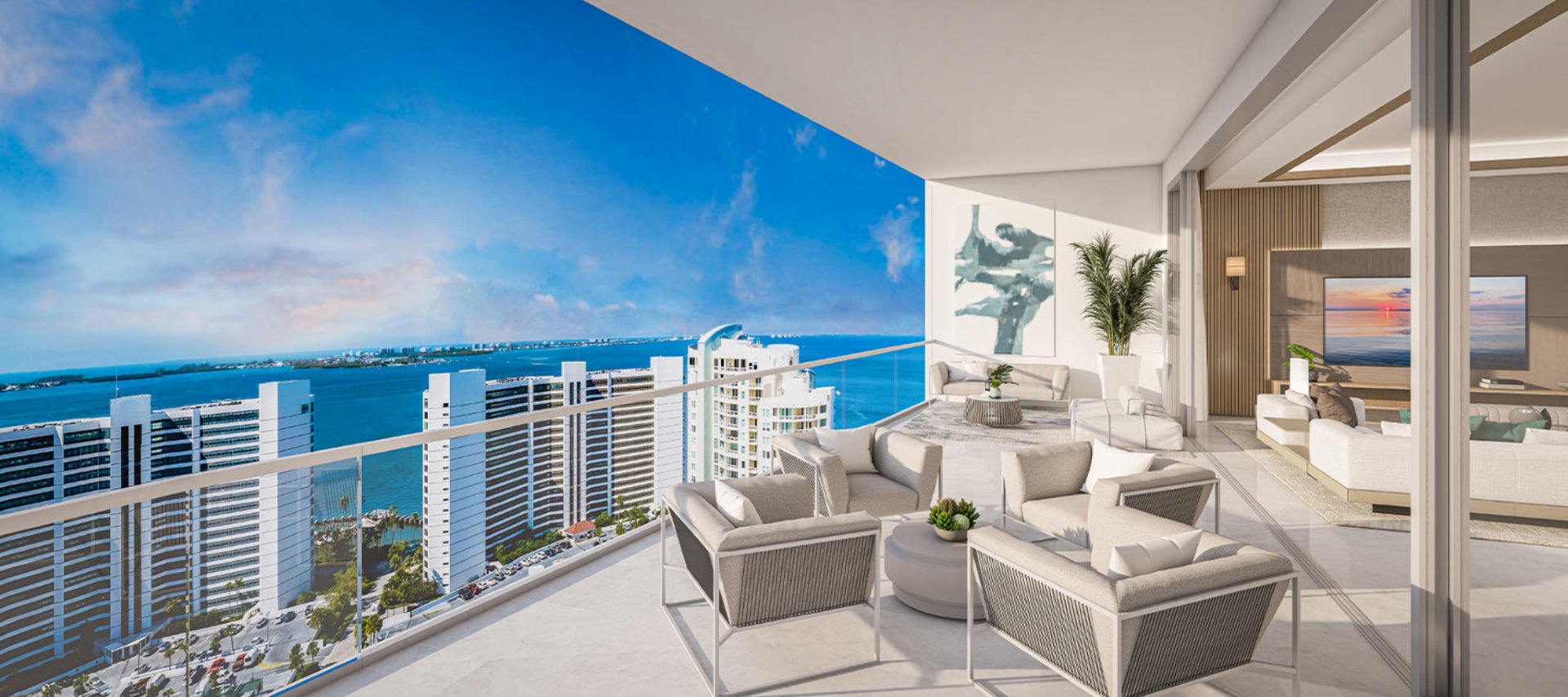 Private residential terrace at The Ritz-Carlton Residences Sarasota Bay with outdoor lounge seating and sweeping views of Sarasota Bay.