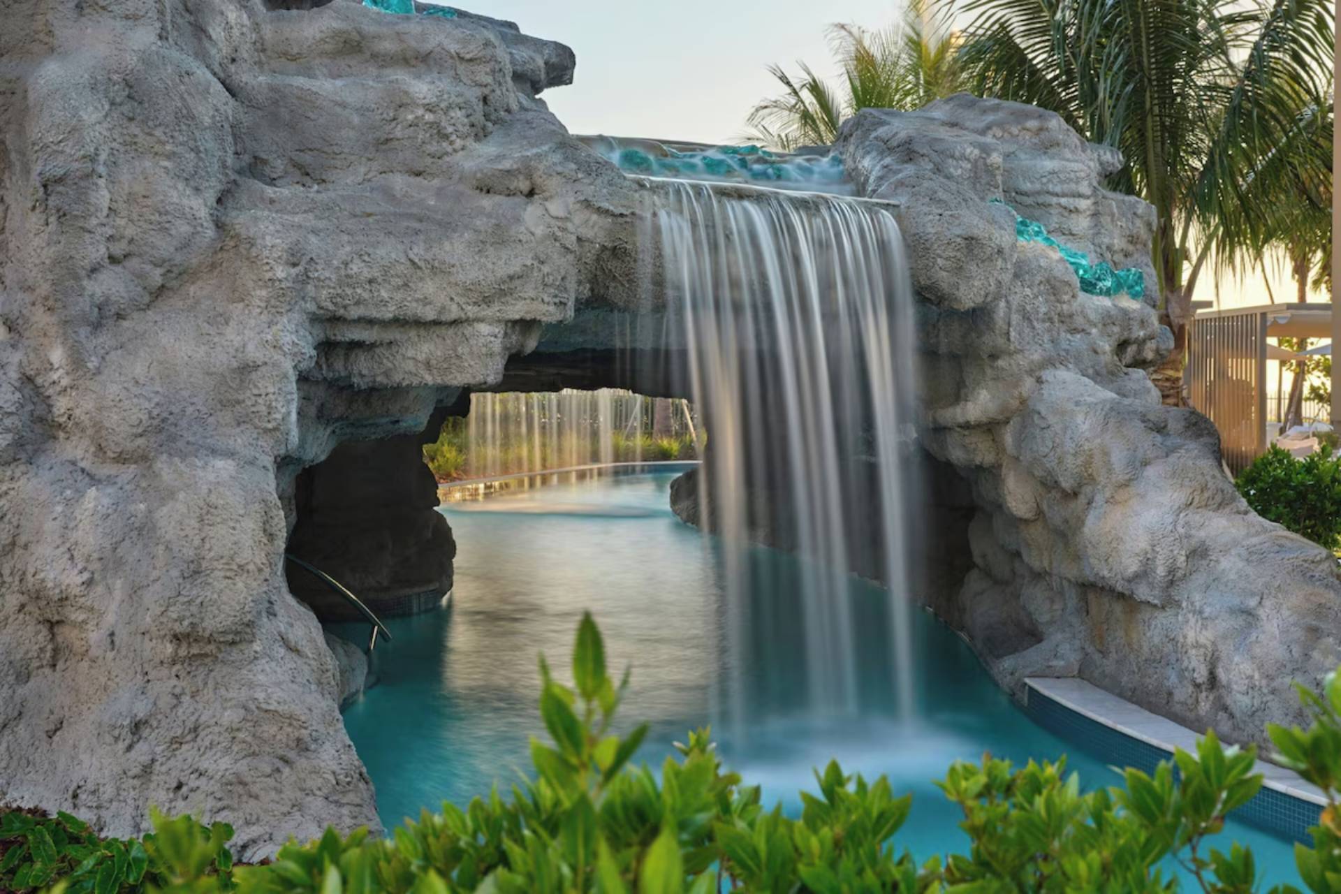 Gulf-front swimming pool at St. Regis Longboat Key Residences overlooking the white-sand beach and the Gulf of Mexico.