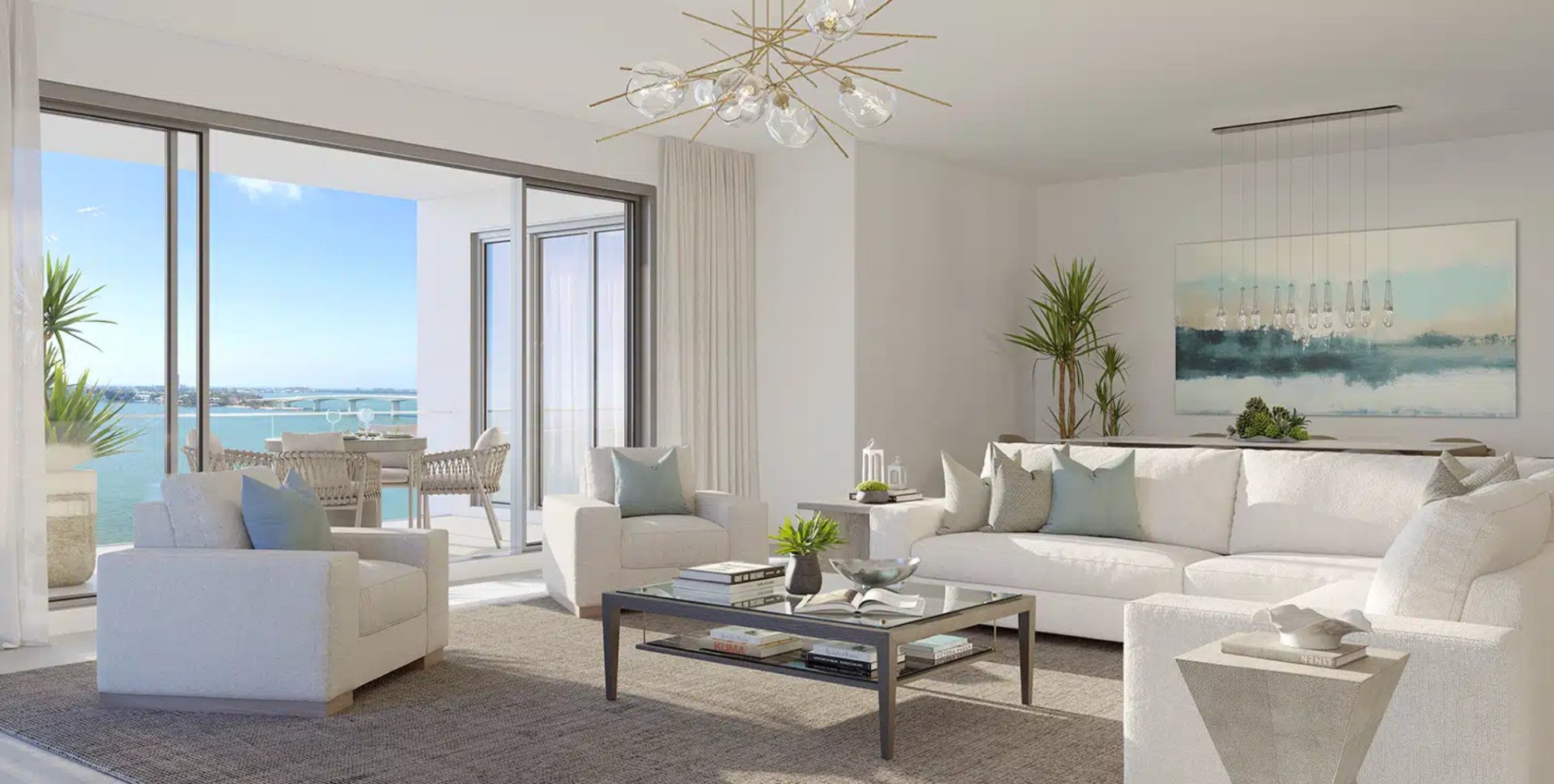 Sophisticated residence interior at The Owen Sarasota featuring open living space, contemporary furnishings, and seamless indoor-outdoor connection to waterfront terrace.