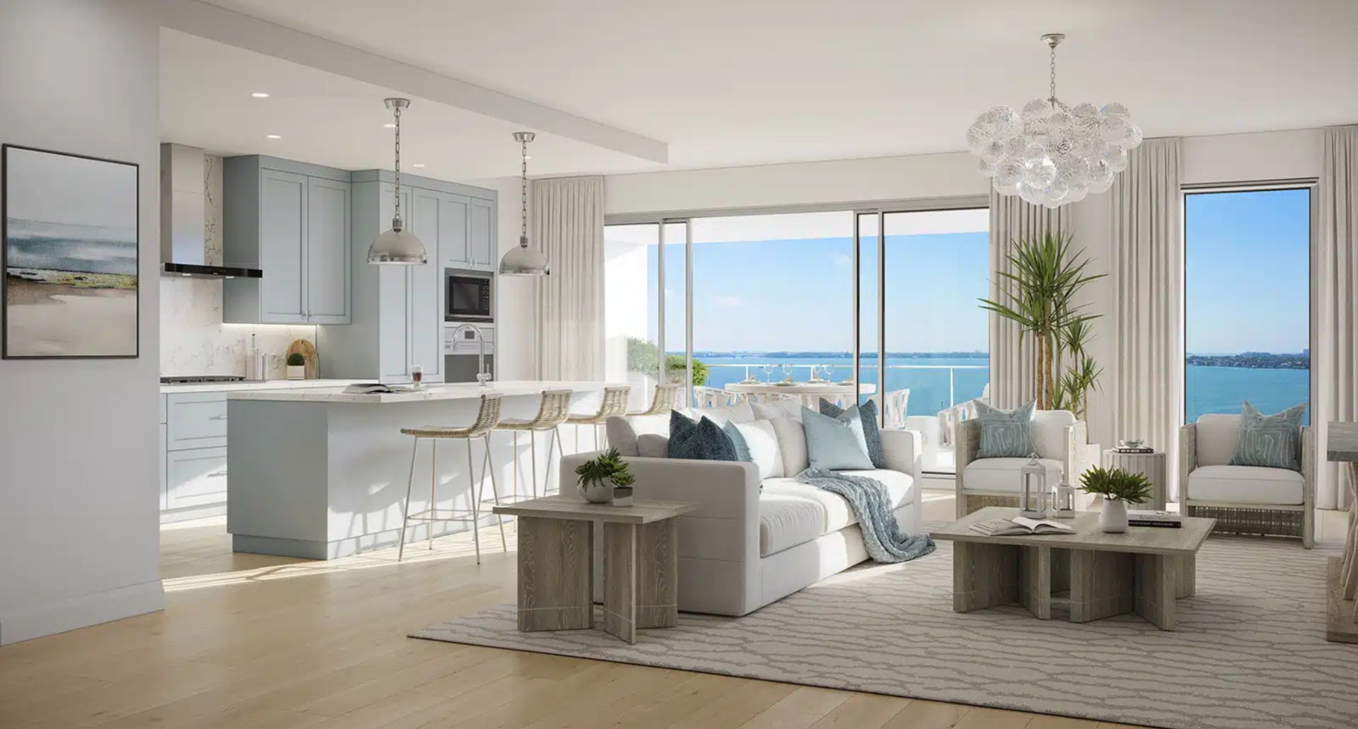 Bright living room at The Owen Sarasota with soft coastal tones, modern finishes, and sliding glass doors opening to a private terrace with water views.