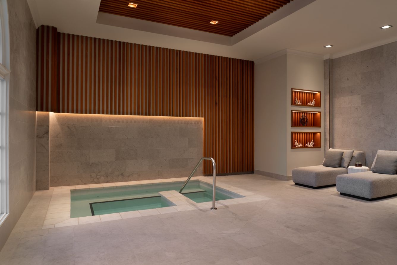 Serene spa interior with plunge pool and relaxation lounge at The Ritz-Carlton Sarasota