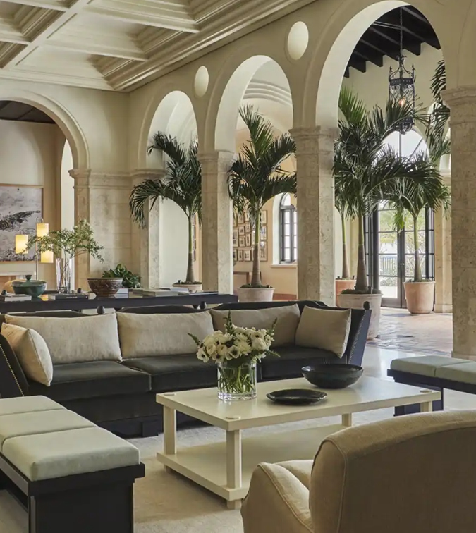 Club Castille lounge at Mira Mar Residences Sarasota with arched architecture, indoor seating, and refined social gathering spaces.