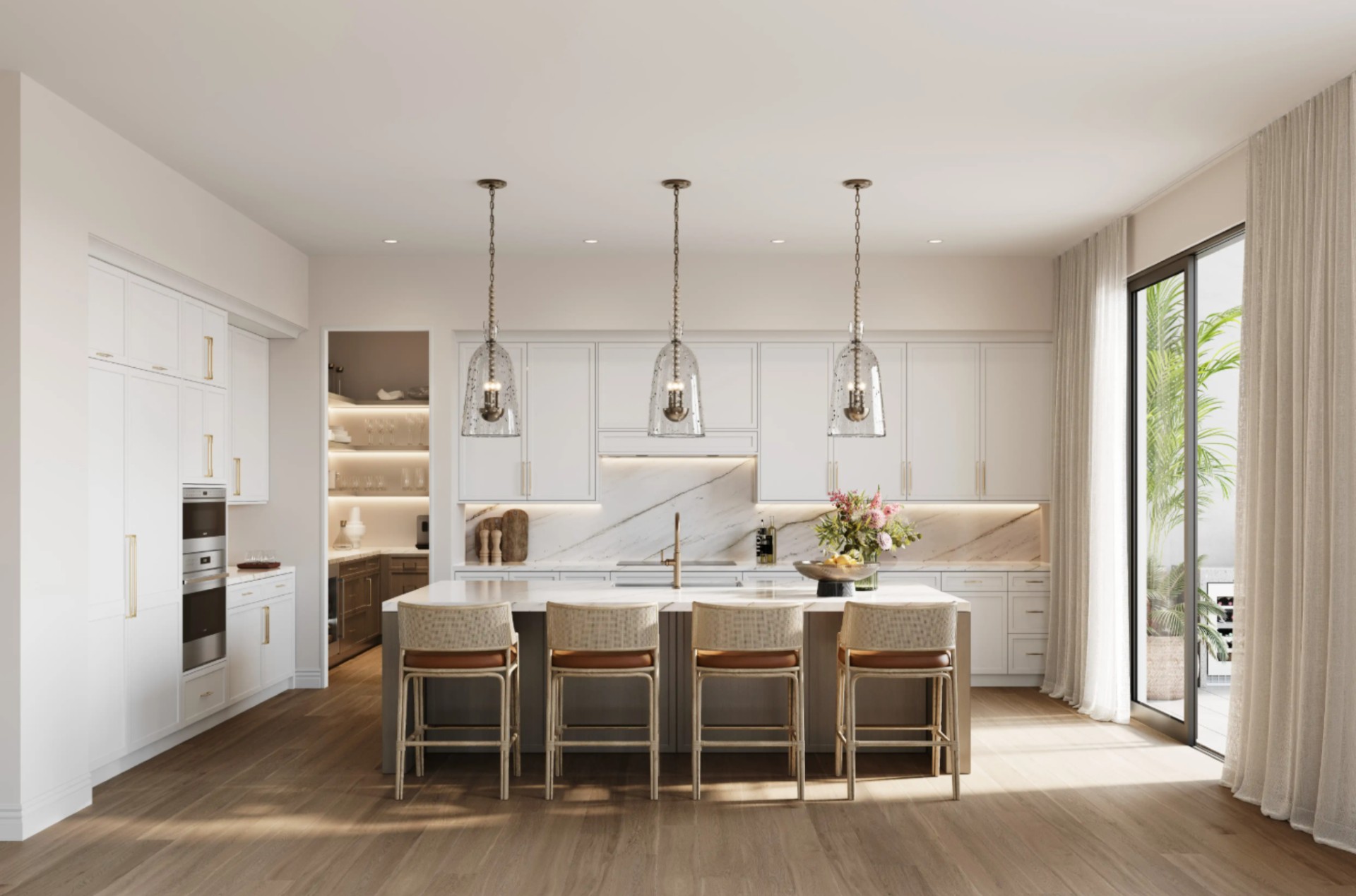 Luxury kitchen at Mira Mar Residences Sarasota featuring a large island, custom cabinetry, marble backsplash, and modern pendant lighting.