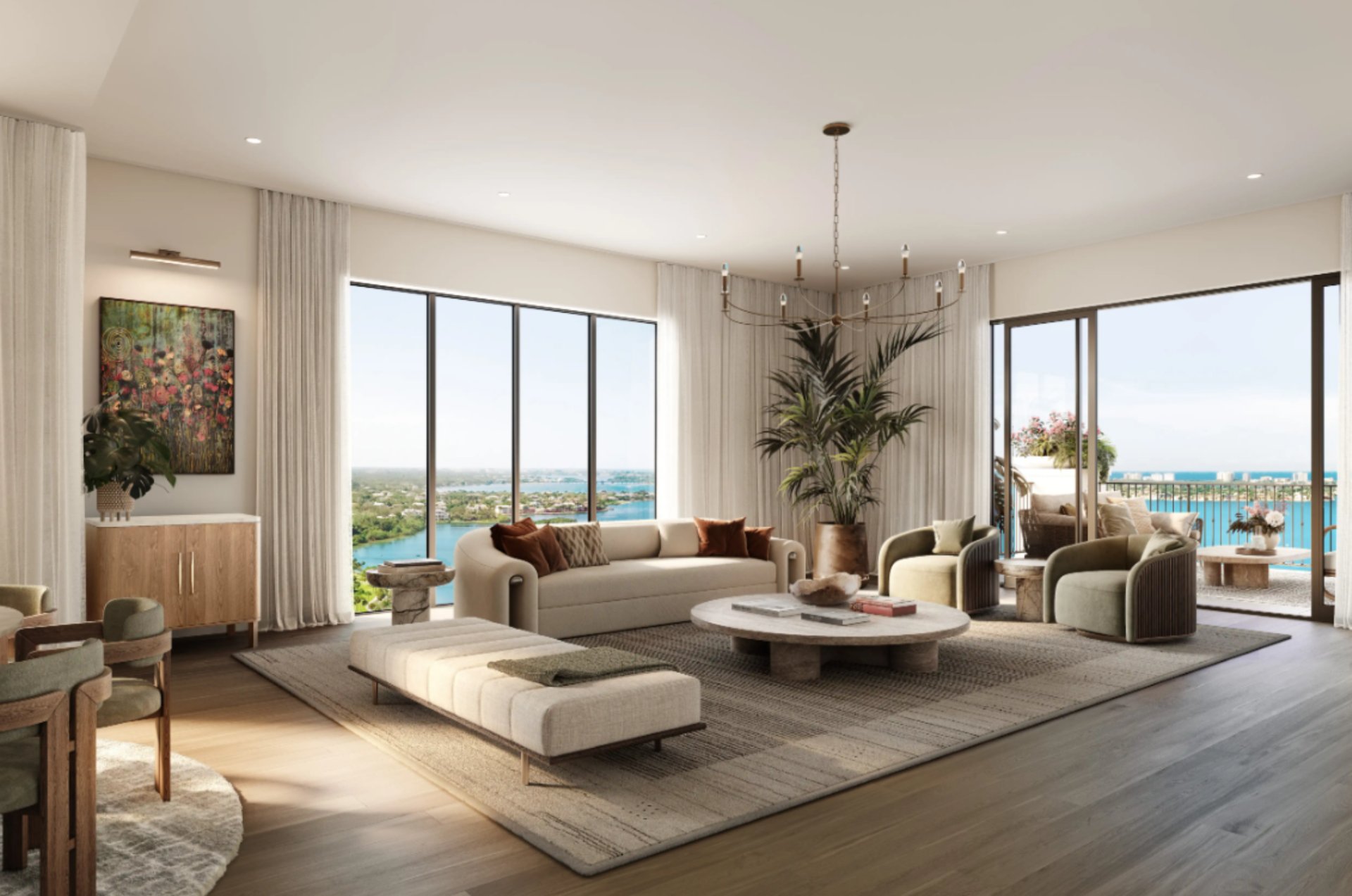 Spacious living room at Mira Mar Residences Sarasota with modern seating, natural light, and expansive views of Sarasota and the water.