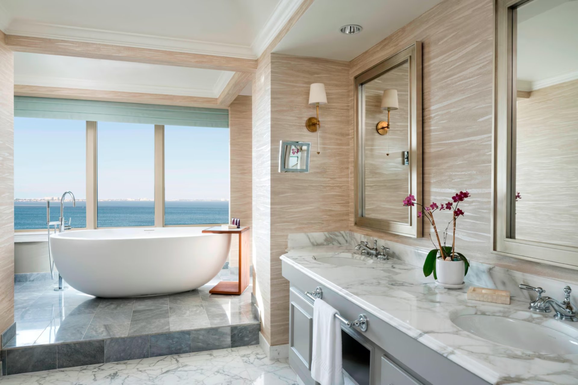 Luxury bathroom with freestanding soaking tub and ocean views at The Ritz-Carlton Sarasota residence