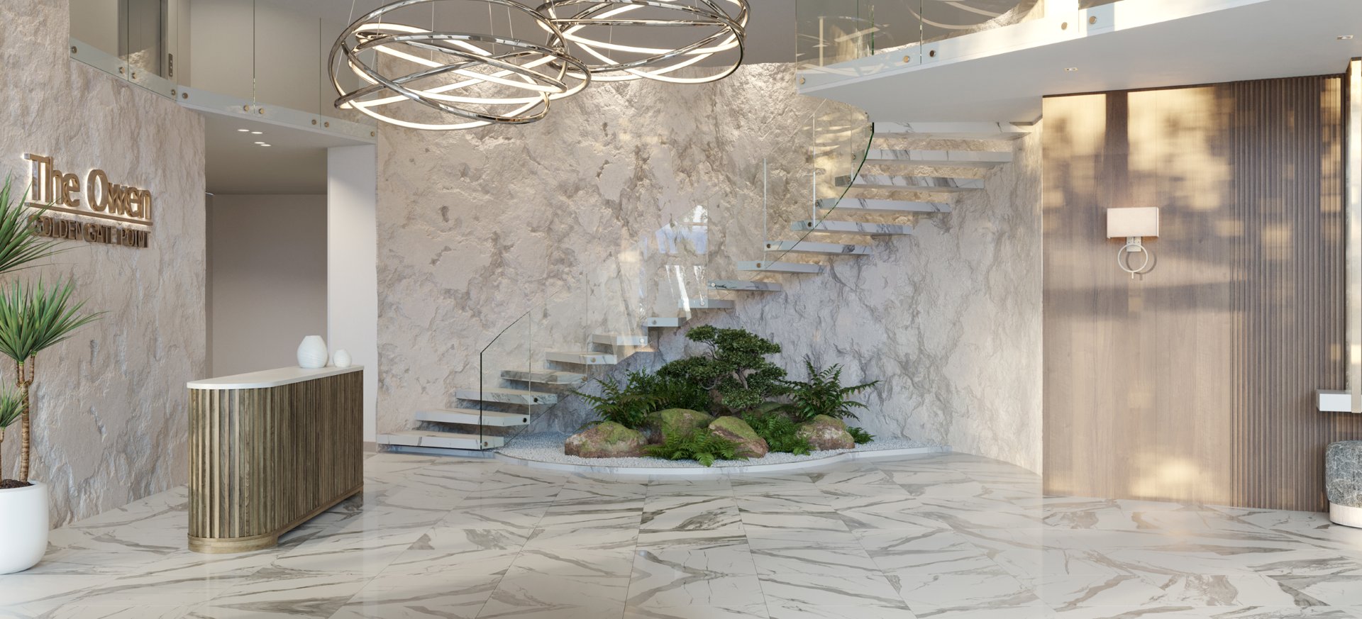 Modern lobby at The Owen featuring marble finishes, sculptural staircase, and concierge-style reception in Sarasota.