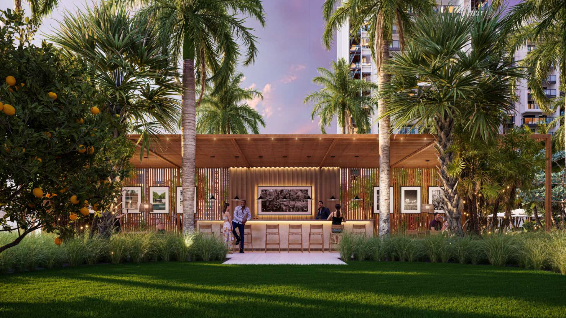 Outdoor bar and social pavilion at Waldorf Astoria Residences Sarasota surrounded by palm trees, landscaped gardens, and elegant open-air entertaining space