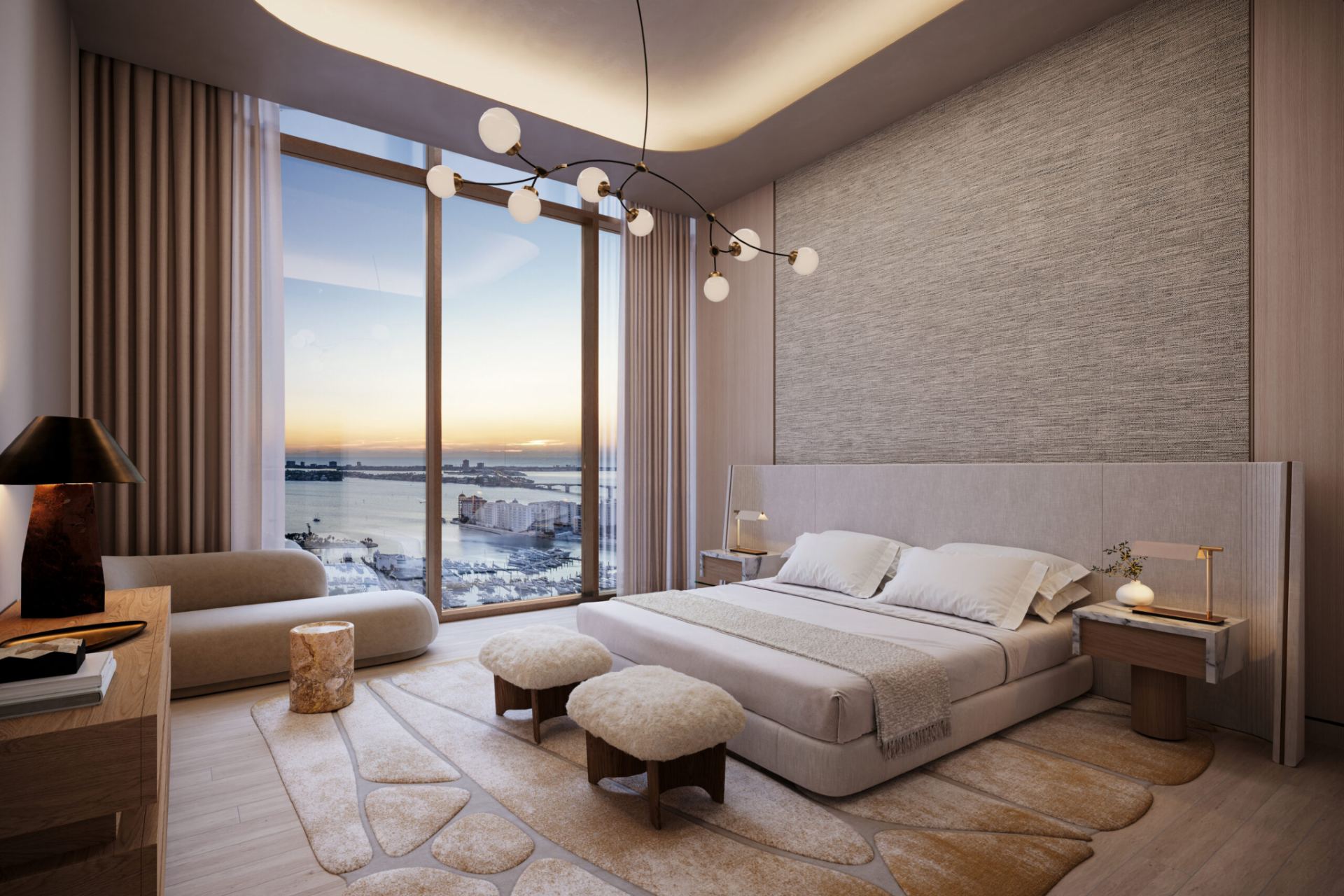 Primary bedroom at Waldorf Astoria Residences Sarasota featuring waterfront views, floor-to-ceiling windows, luxury finishes, and modern interior design with soft neutral tones