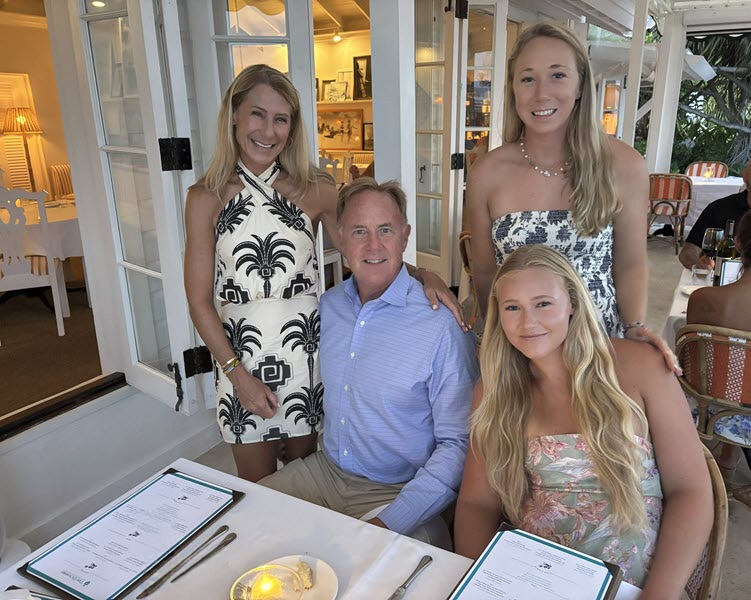 Steve, Janet, Lucy, and Reagan Walter enjoying dinner together at a waterfront restaurant on Longboat Key, reflecting their family's connection to the coastal community they proudly call home.