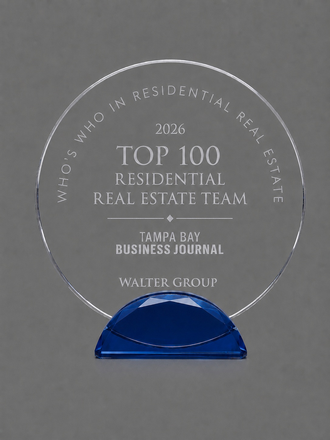 Crystal award recognizing Walter Group as a Top 100 Residential Real Estate Team in 2026 by the Tampa Bay Business Journal's Who's Who in Residential Real Estate.