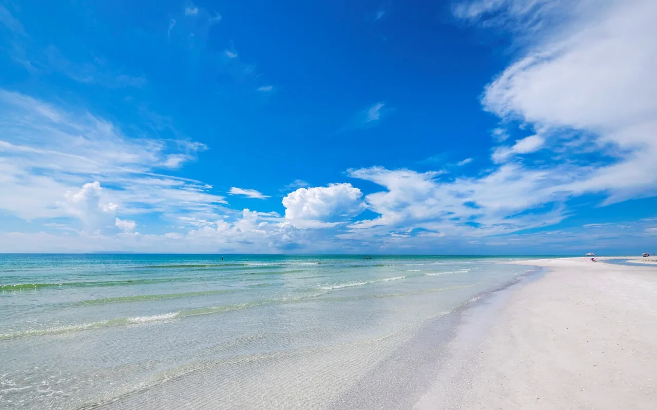White sand beach and clear Gulf waters along the shoreline of Longboat Key, Florida