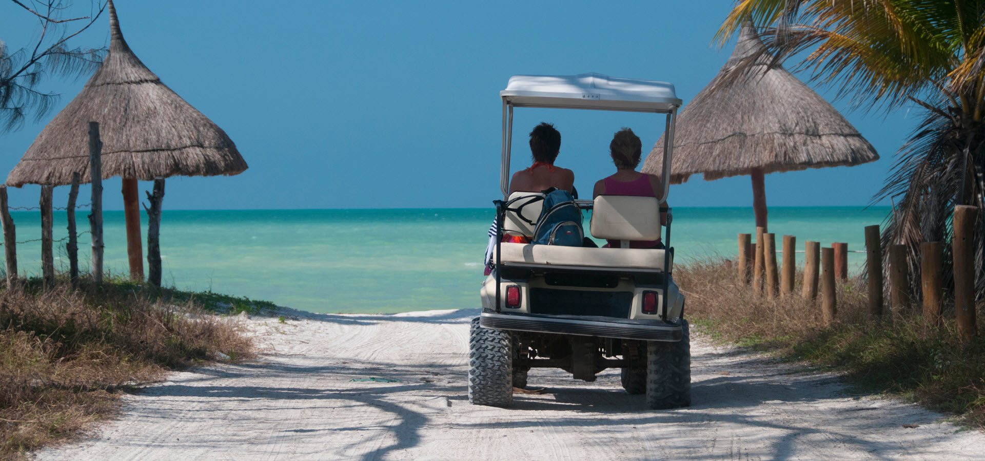 Golf cart on beach access road